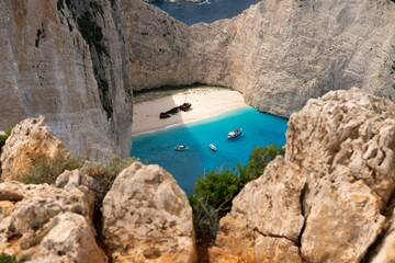 Scenic Navajo beach in Greece with an azure blue sea, crystal clear white sand