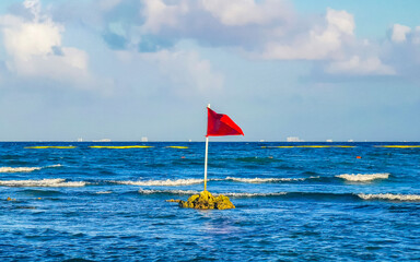 Red flag swimming prohibited high waves Playa del Carmen Mexico.