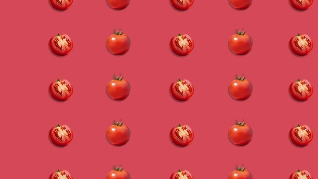 Stop motion Cut and whole Tomato appear and disappear on pasatel background. High quality video 4K. Detailed stop motion video. Background or wallpaper in food and drinks videos.