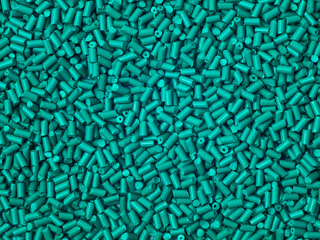 Cold-cut type turquoise masterbatch granules photographed in full screen, this material is used as...