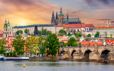 Prague cityscape with Hradcany castle and Charles bridge at sunset, Czech Republic