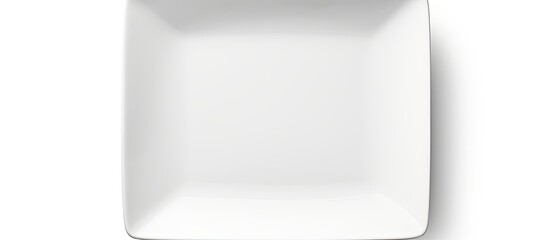 A white ceramic plate with nothing on it is alone on a white background There is a clipping path around it