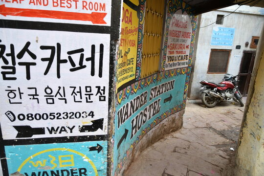 VARANASI, INDIA - November 13, 2022: Historic Varanasi city narrow alleyway with old weathered buildings