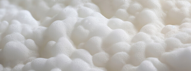 Fototapeta na wymiar Macro shot of white foam texture.