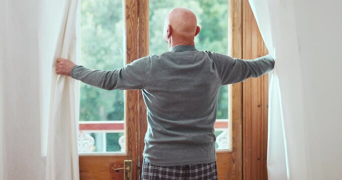 Open curtains, morning and senior man in home for fresh air, sunlight and getting ready for day. Retirement, house and back of elderly person by window for view and start, wake up and relax in room