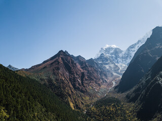 Naklejka premium Mountain landscape of Nepal with snowy peaks with clouds in sunny weather