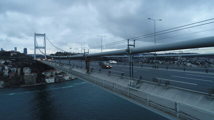 Obraz premium Istanbul Bosphorus Bridge, 15 July Martyrs Bridge from Sky Aerial view. suspension bridge vehicle traffic