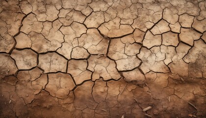 dry soil cracks, showcasing lack of water and the effect of global warming on earth - obrazy, fototapety, plakaty