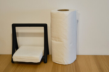 Rolls of paper towels on a wooden table in the kitchen