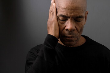 suffering from deafness and hearing loss on grey black background with people stock image stock...