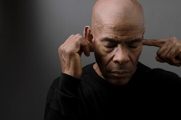 suffering from deafness and hearing loss on grey black background with people stock image stock...
