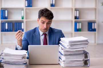 Young male employee working in the office