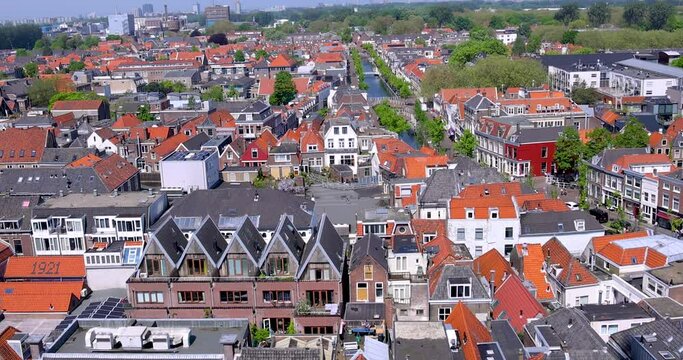 Delft, Netherlands - May,12,2023: Aerial view of typical colorful Dutch style homes in Delft city centrum, Netherlands.
