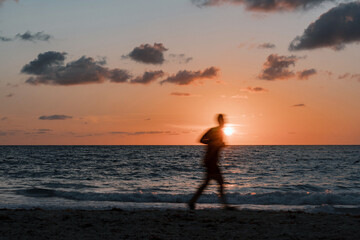Sunrise Stride: A Jogger's Journey Along the Beach