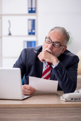 Old male employee and too much work in the office