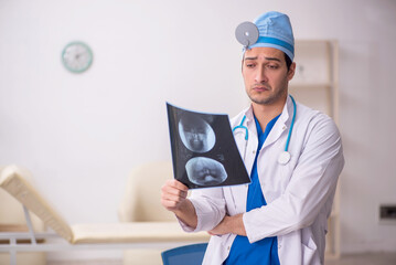 Young male doctor radiologist working in the clinic