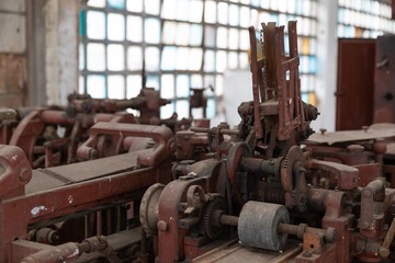 Fototapeta premium Cluster of vintage industrial machines, featuring their intricate mechanisms and complex details