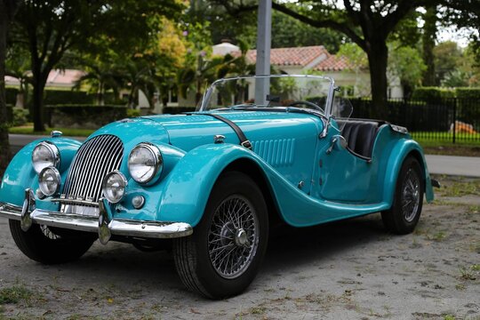 Antique blue car parked on the roadside