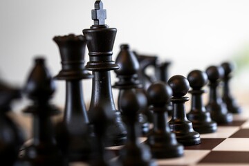 Closeup of chess pieces on a chessboard