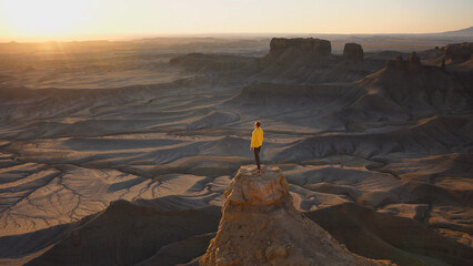 Man watching sunrise at Moonscape Overlook in Utah, USA