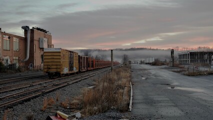 Fototapeta na wymiar Old, abandoned train sits on a set of railroad tracks