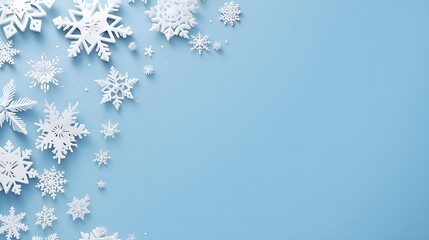 Christmas background paper cut snowflakes blue pastel color at the blue background,copy space.