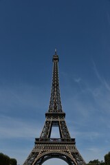 Iconic Eiffel Tower in Paris on the backdrop of the sky