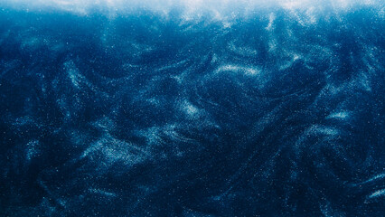 Obraz premium Dust particles background. Glitter swirls. Light shimmering shiny liquid sparks ink flow on dark blue abstract hypnotic mysterious space art.