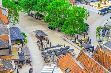 Aerial top view of Kortrijk historical city centre, street restaurants, green trees on Grote Markt Courtrai Central market square, Kortrijk old town, West Flanders province, Flemish Region, Belgium