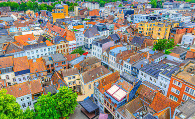 Fototapeta na wymiar Aerial view of Kortrijk historical city centre with red tiled roofs of old colorful buildings, Kortrijk cityscape amazing view, Kortrijk old town, West Flanders province, Flemish Region, Belgium