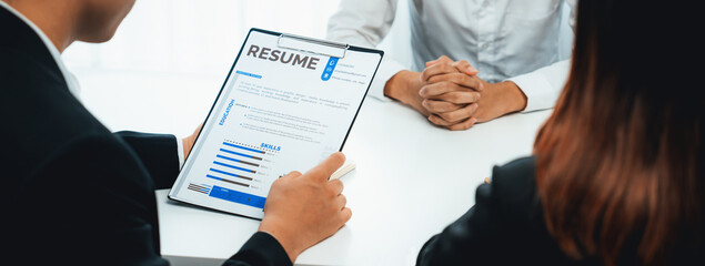 Candidate in job interview with human resources manager at office desk having oratory conversation...