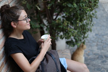 Women with a cat in the alhambra of granada, andalusia, spain