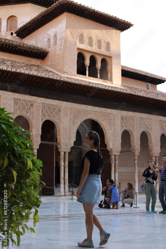 Wall mural woman walking in the Alhambra of Granada, Andalusia, Spain