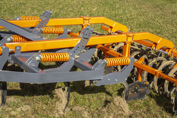 plow farming equipment machine cultivator on a field working