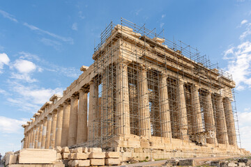 Obraz premium The facade of the Temple of Parthenon in Acropolis Athens hill, Greece - ancient temple with colonnade