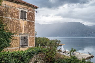 Fototapeta na wymiar A scenic view of Kotor Bay on a cloudy day in Montenegro.