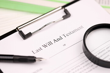 Last Will and testament blank document on A4 tablet lies on office table with pen and magnifying...