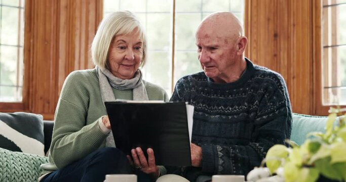 Finance, documents and senior couple on a sofa confused by tax, audit to bankruptcy in their home. Budget, fail and old people with anxiety for savings, investment or inflation crisis in living room