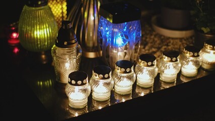 Cemetery Grave Tombstone Decorated with Candle Lanterns on All Saints Day Evening