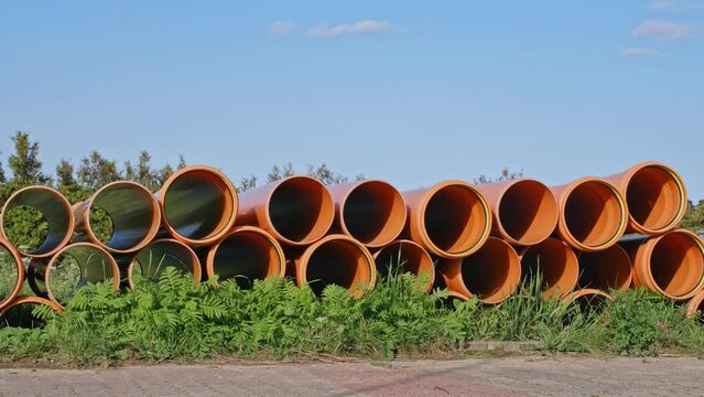 Industrial PVC Pipes Stacked at City ​Sewage System Construction Site 