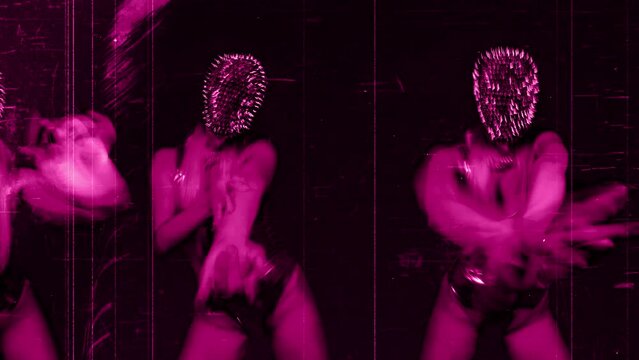 A woman with a spiky mask dancing