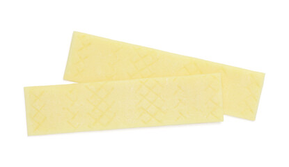 Sticks of tasty yellow bubble gums isolated on white, top view