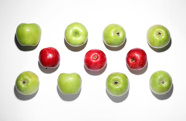 Ripe green and red apples on white background, flat lay