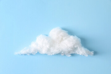 Cloud made of cotton on light blue background