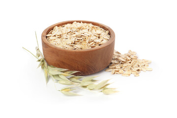 Wooden bowl with oatmeal and floret branches isolated on white
