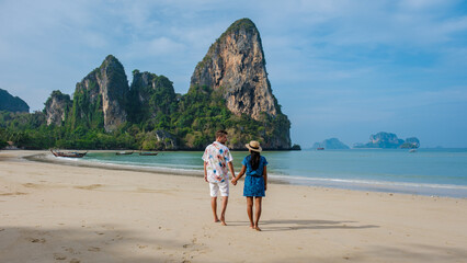 Railay beach Krabi Thailand, tropical beach of Railay Krabi, couple men and woman on the beach
