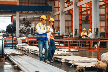 Factory foreman worker and engineer conduct inspection of steel machine and heavy industrial material quality product. Metal sheet manufacture with machinery safety and quality control. Exemplifying - obrazy, fototapety, plakaty