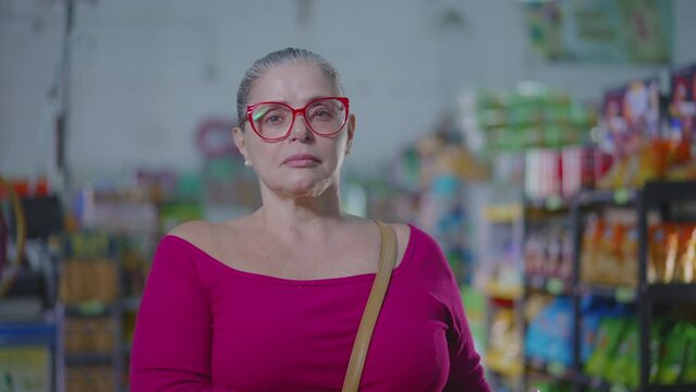 Middle-Aged Woman Struggling with Inflation Inside Grocery Store, Hard Times Consumer Portrait