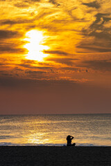 Fototapeta premium silhouette of a person on the beach