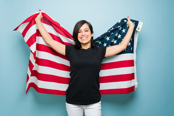 Cheerful caucasian woman loving the american dream and US flag